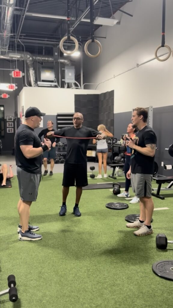 Men lifting weights together, happy, prosper texas