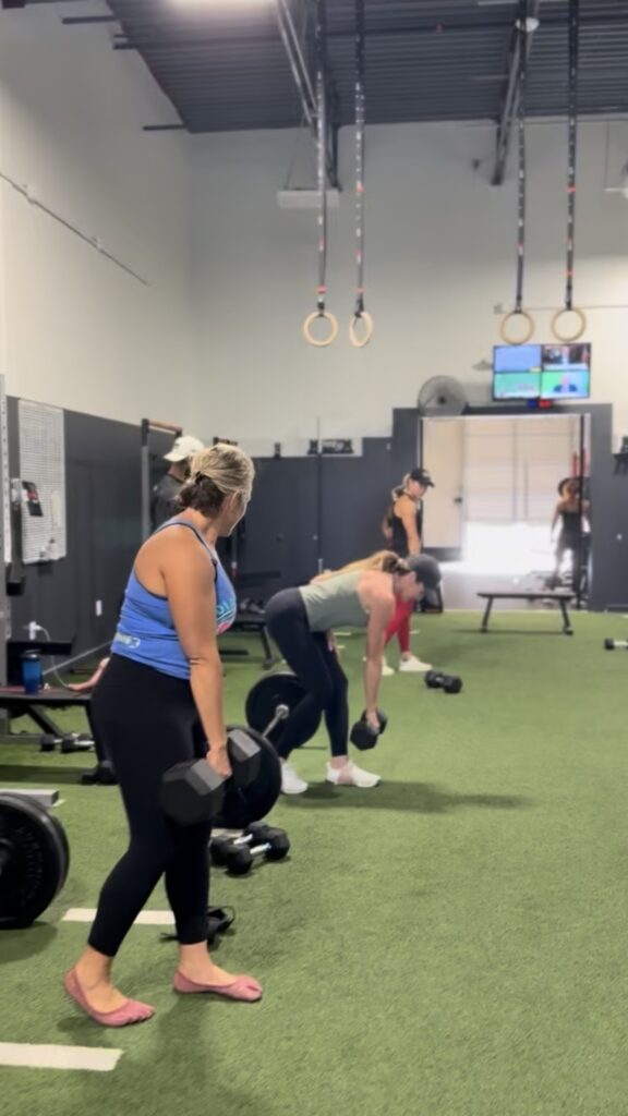 Women lifting weights, strength training, prosper texas