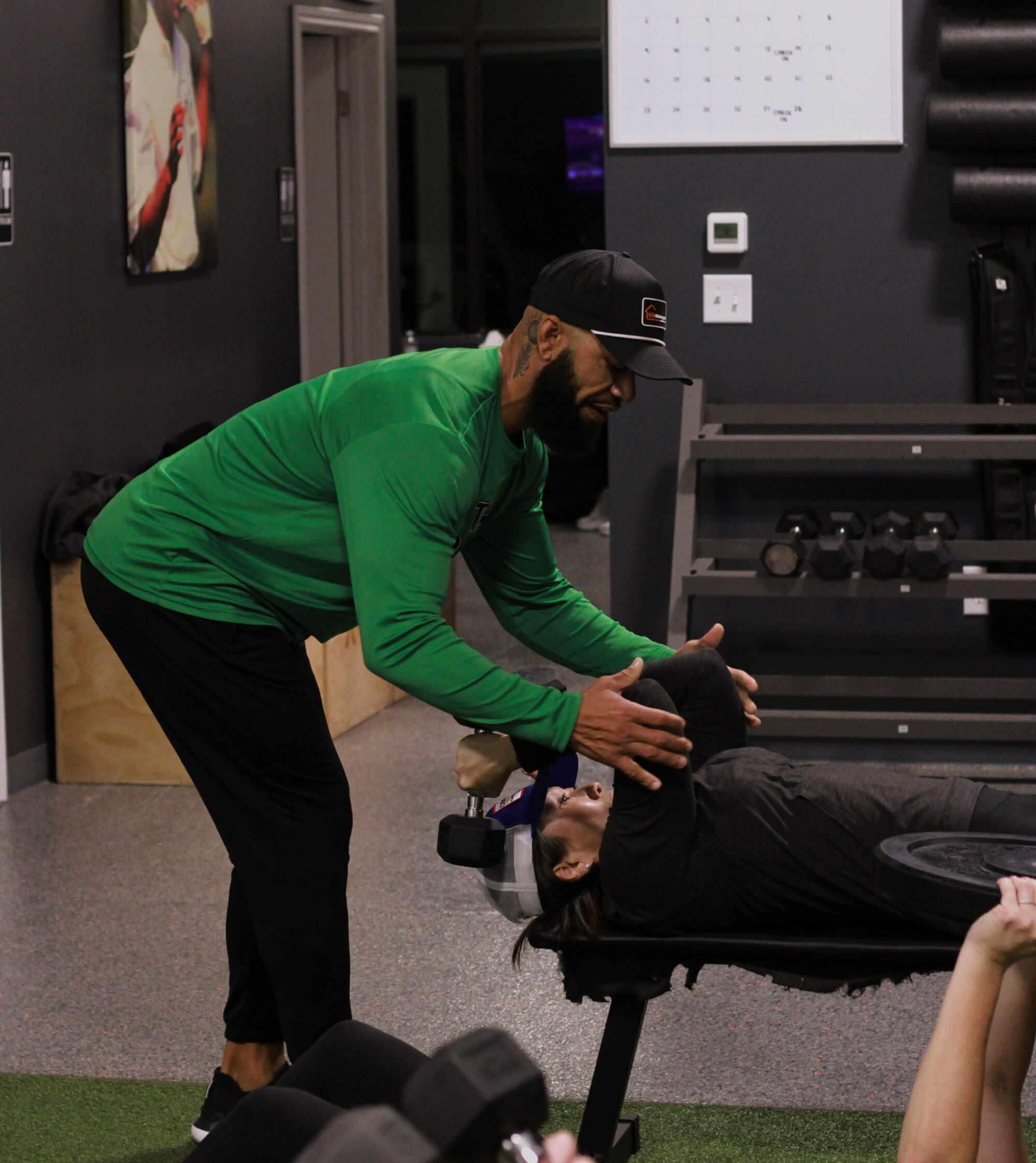 Coach helps spot client on exercise, prosper texas