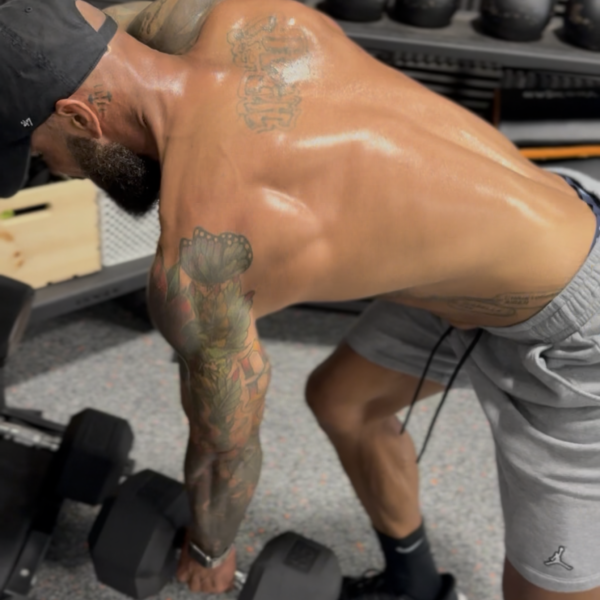 Man strong working back, dumbell row